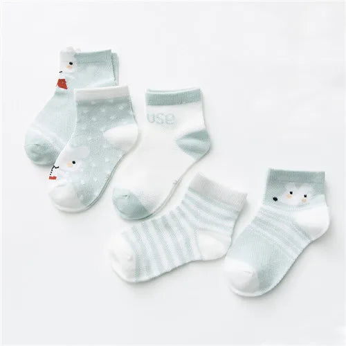Set of five baby socks by Baby Bubble made of soft cotton, featuring colorful and cozy designs for infant comfort.
