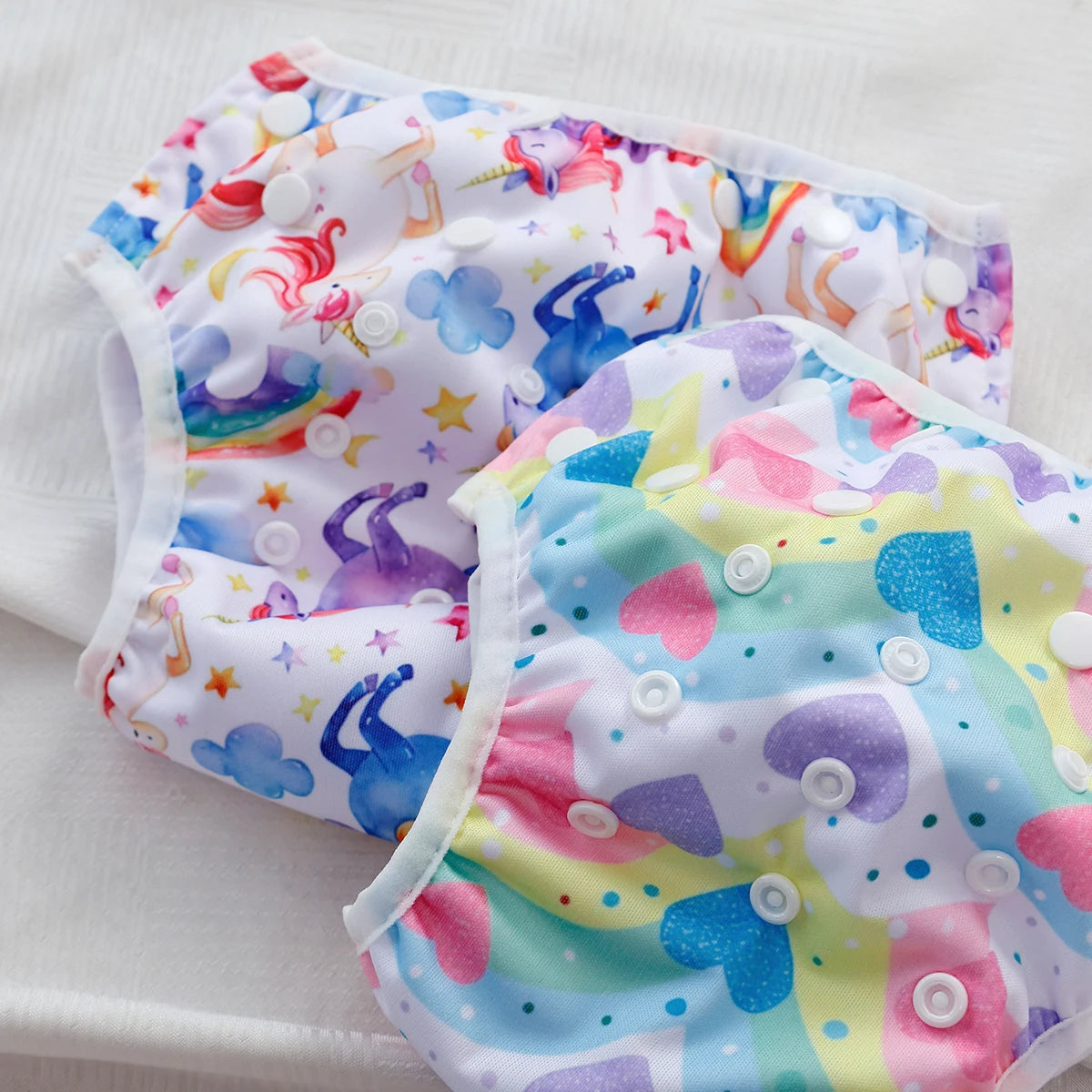Baby Bubble washable baby swim diapers with adjustable fit, shown in a colorful waterproof design on a baby.