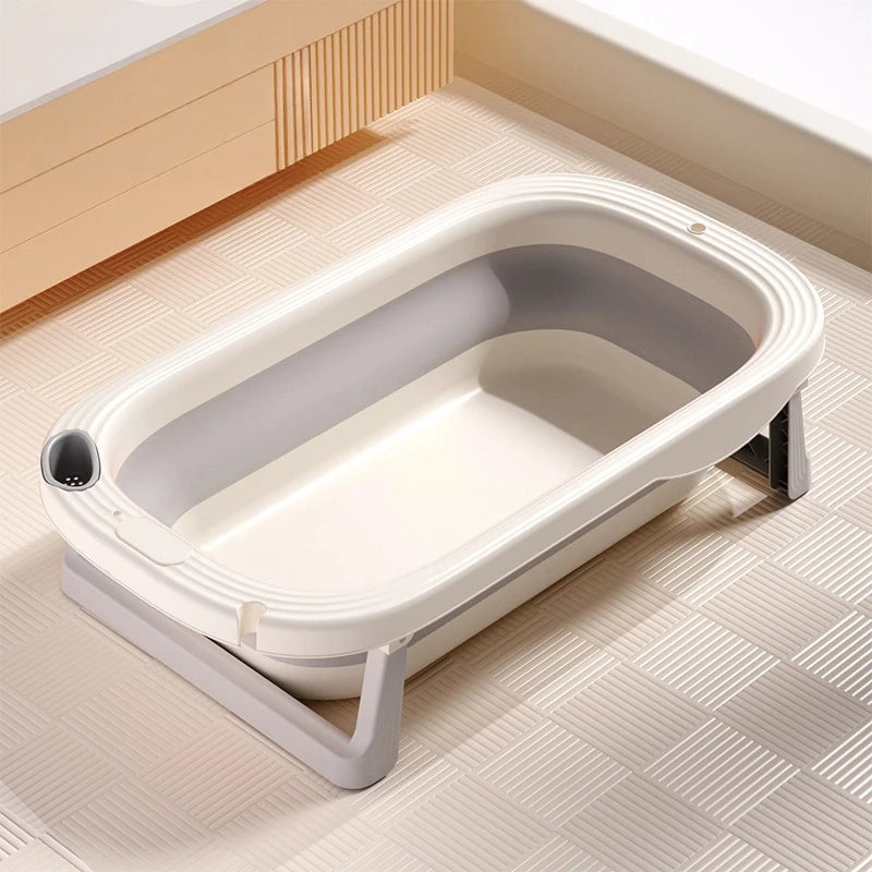 Foldable Baby Bath Tub with temperature sensor from Baby Bubble, featuring a compact design and safe water temperature monitoring.