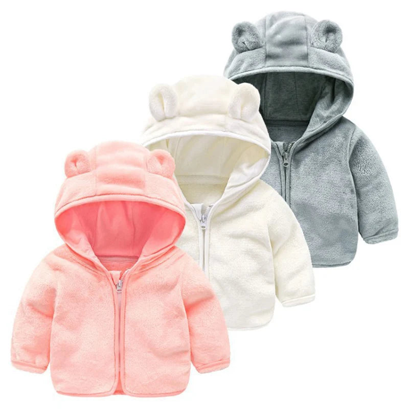 Baby Bubble hooded baby girl coat in soft pink fabric with a cute hood, perfect for keeping her warm and stylish.