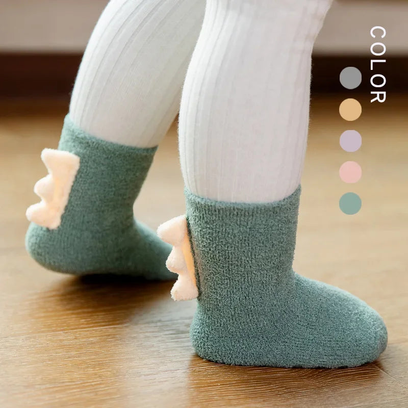 Cute baby dinosaur socks by Baby Bubble featuring colorful, soft, and warm knit fabric perfect for little feet.