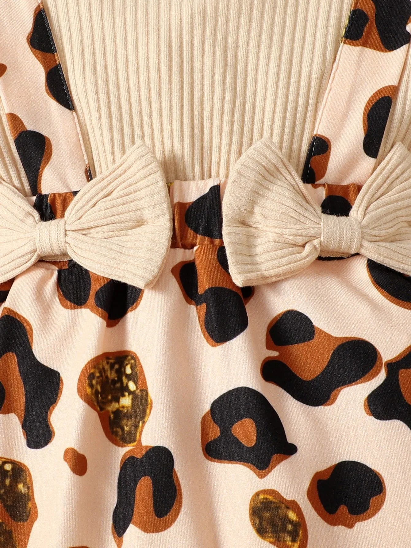Baby Girl Leopard Jumpsuit Set by Baby Bubble featuring a leopard print jumpsuit with ruffle trim and matching headband.