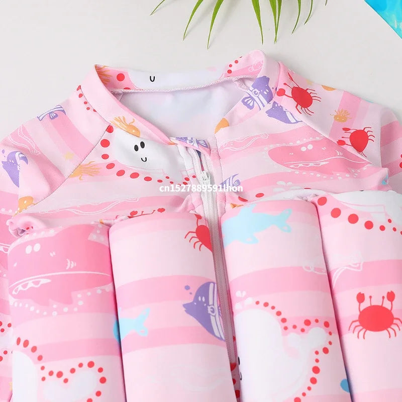 Kids buoyancy swimsuit by Baby Bubble featuring a colorful cartoon float design, designed for safe swimming and water play.