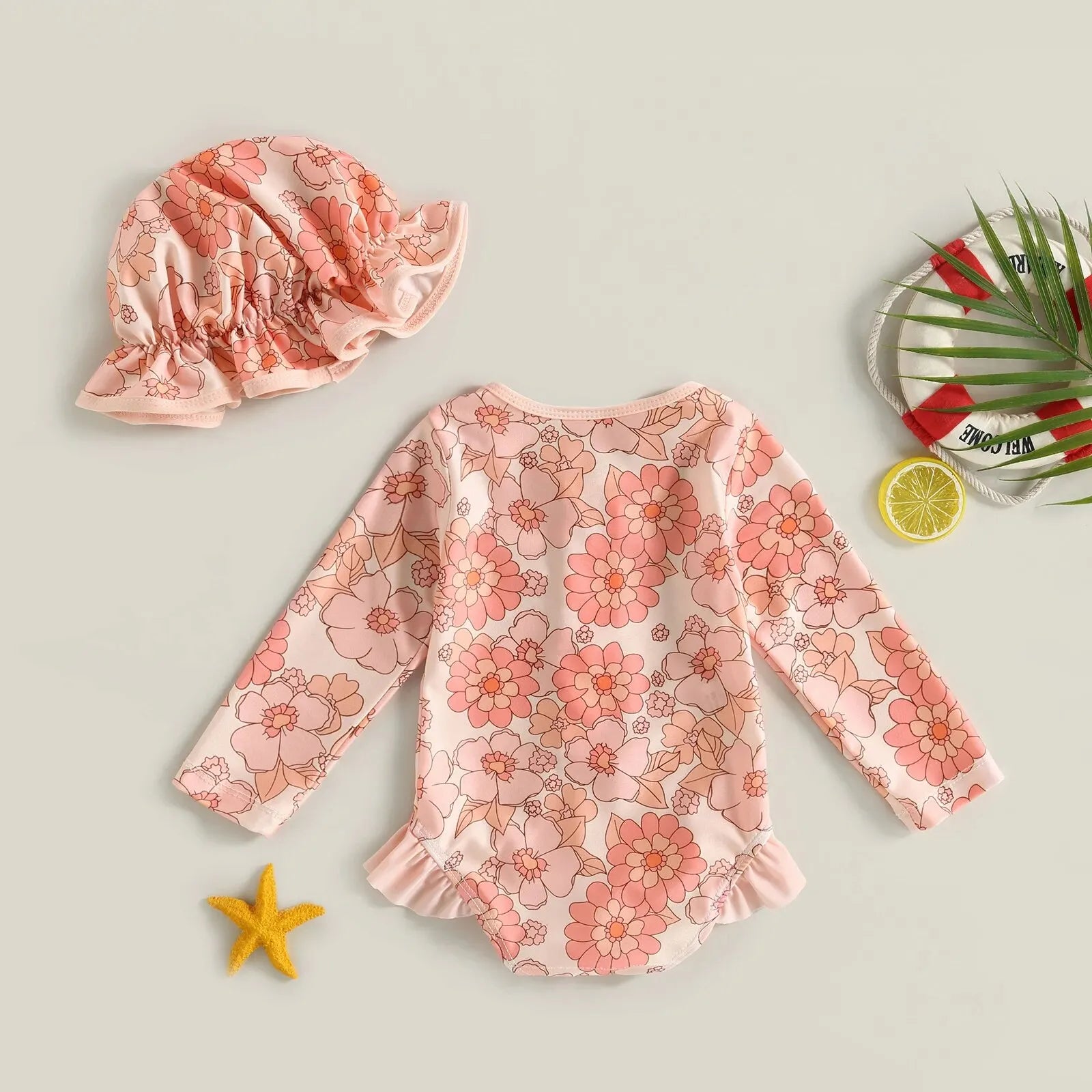 Baby Girl one-piece swimsuit with floral flamingo print from Baby Bubble, featuring bright colors and playful tropical design.