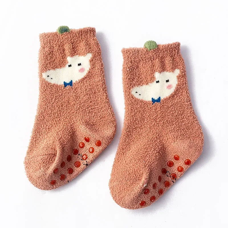 Baby Bubble baby dinosaur socks in soft, warm fabric with colorful dinosaur patterns for infants.