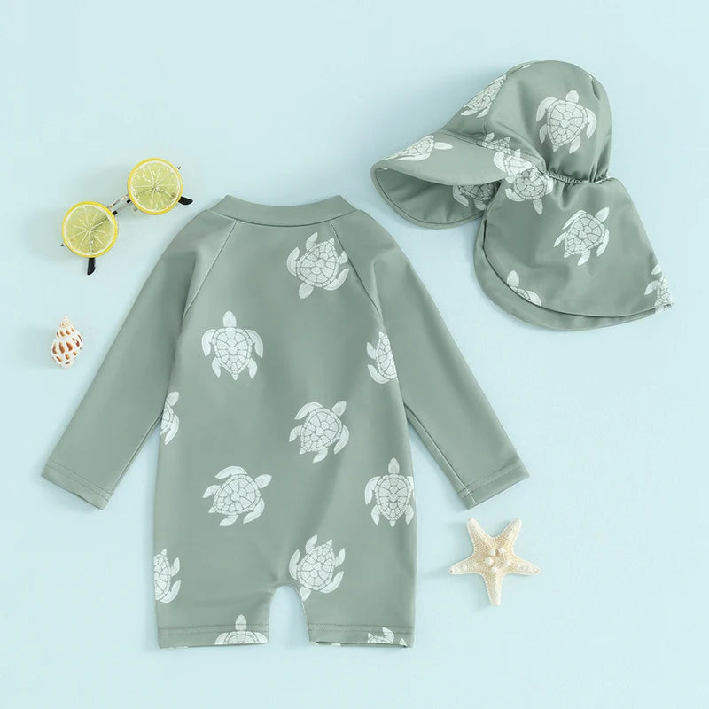 Baby boys rash guard set by Baby Bubble featuring turtle and dinosaur print, long sleeve swim shirts for sun protection.