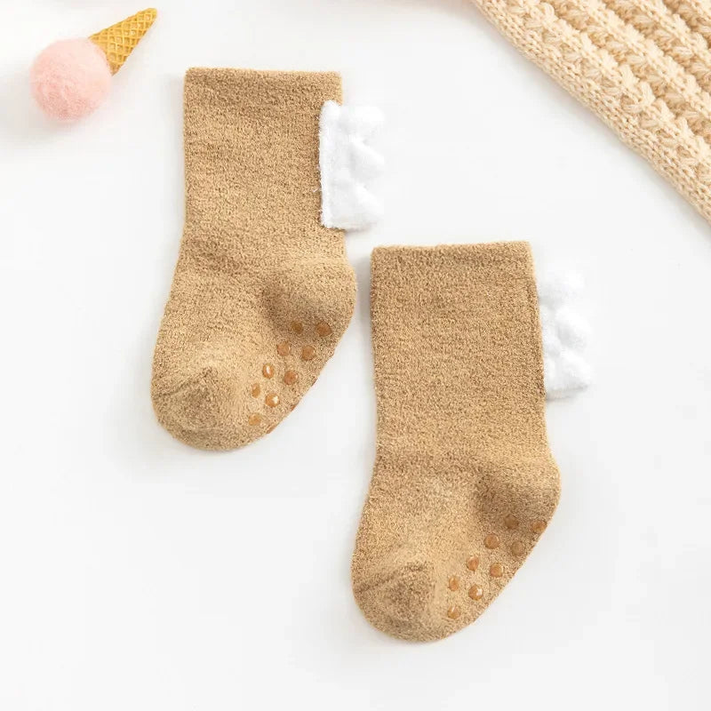 Baby Dinosaur Socks from Baby Bubble, soft and warm baby socks featuring colorful dinosaur designs, perfect for little feet.
