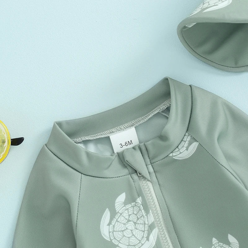 Baby boys rash guard set with turtle and dinosaur print by Baby Bubble, featuring colorful sun protection swimwear for infants.