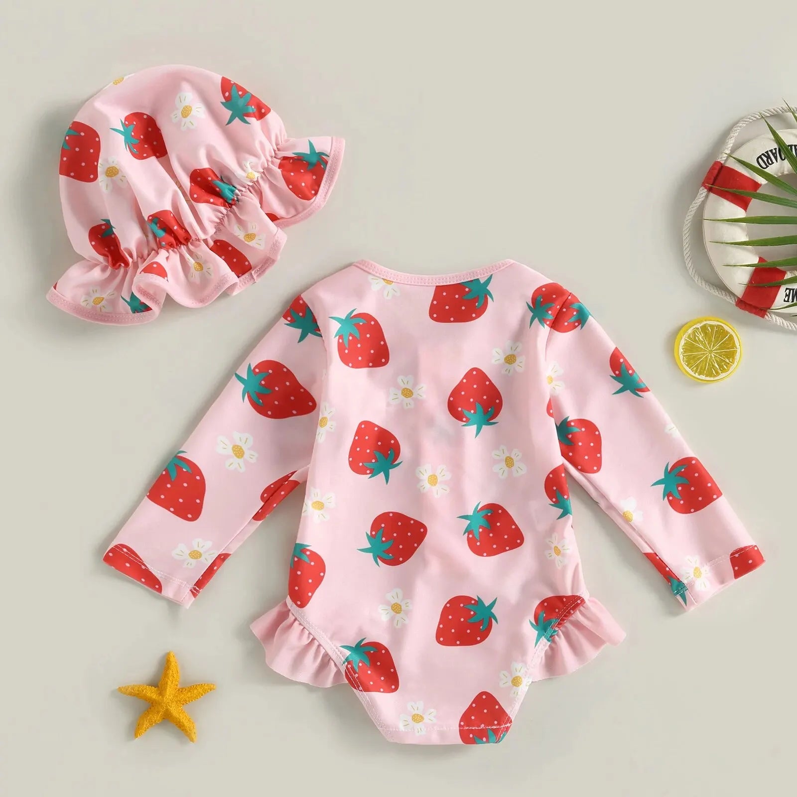 Baby girl one-piece swimsuit with floral flamingo print by Baby Bubble, featuring colorful tropical design and adjustable straps.