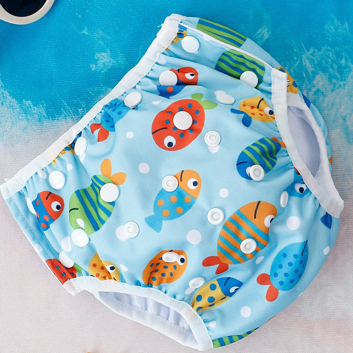 Baby Bubble washable baby swim diapers with adjustable fit, featuring colorful waterproof material and secure fastening.