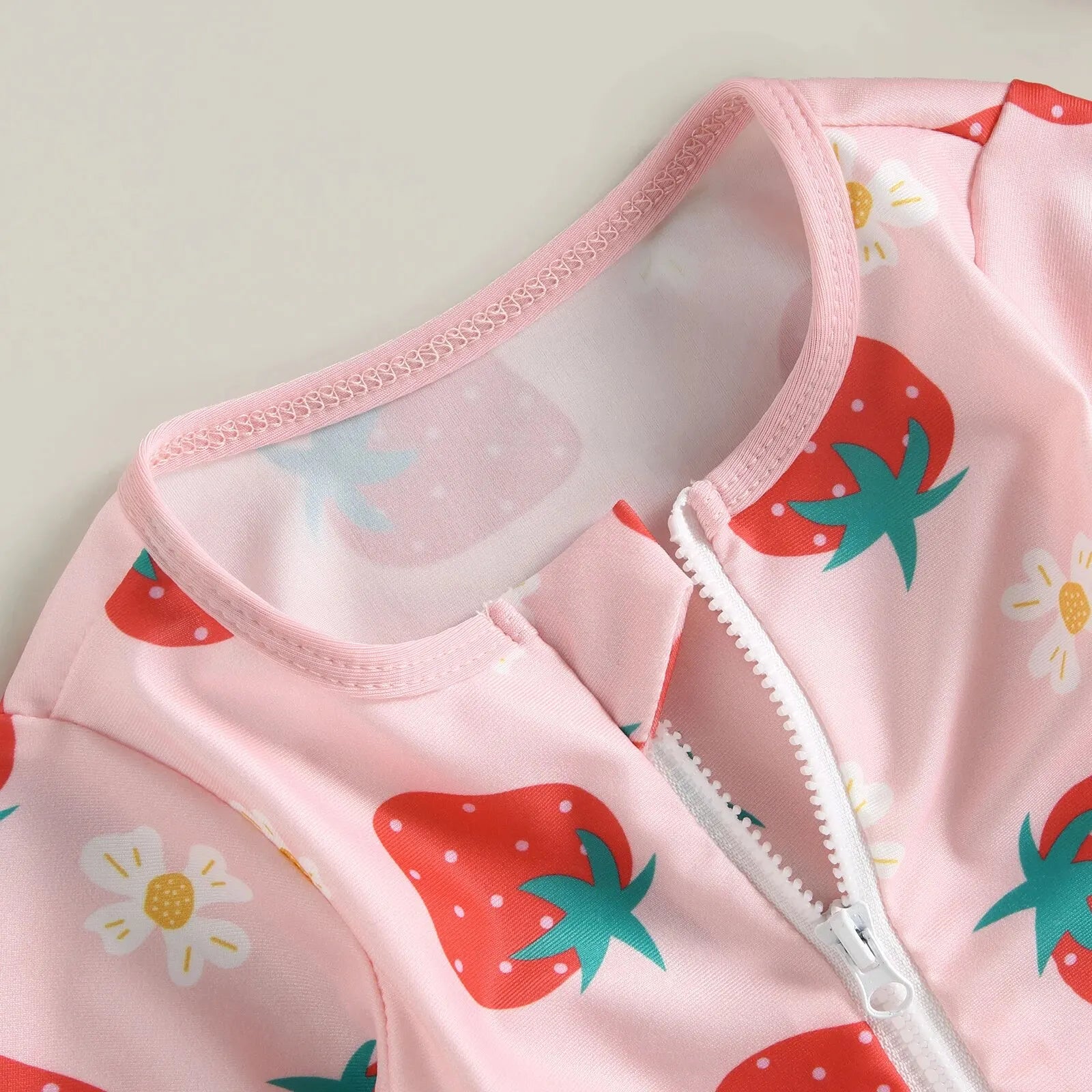 Baby girl one-piece swimsuit with floral flamingo print by Baby Bubble, featuring colorful tropical design and comfortable fit.