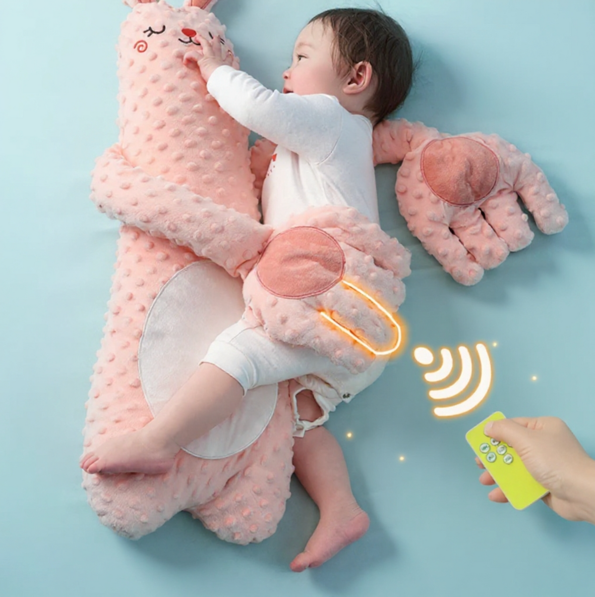 Baby patting pillow with remote control, soft fabric and adjustable settings for peaceful sleep.
