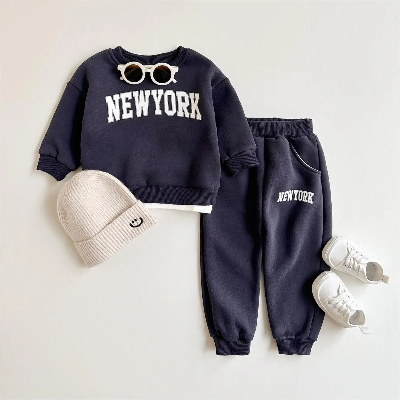 Baby Bubble baby winter outfit featuring a New York print top and matching pants in a cozy 2-piece set.