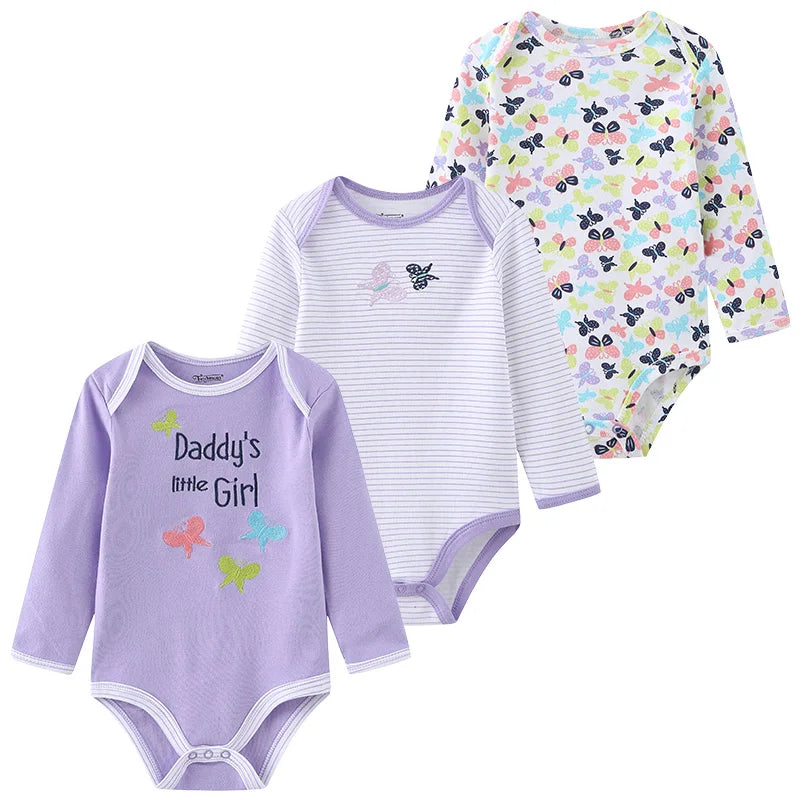 Three soft newborn cotton bodysuits from Baby Bubble, displayed flat with snap closures and gentle pastel colors.