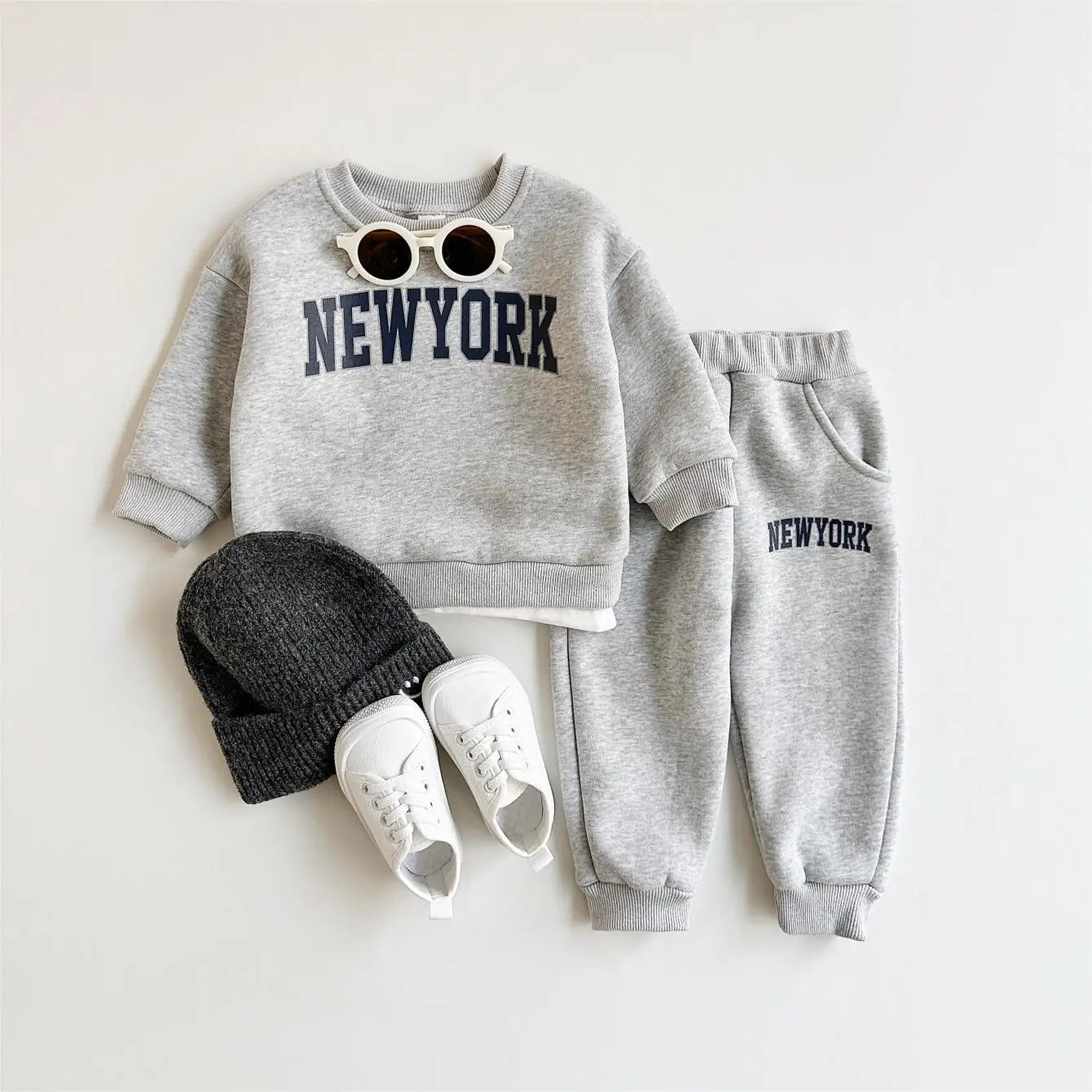 Baby Bubble baby winter outfit with New York print top and matching pants, cozy 2-piece set for infants.