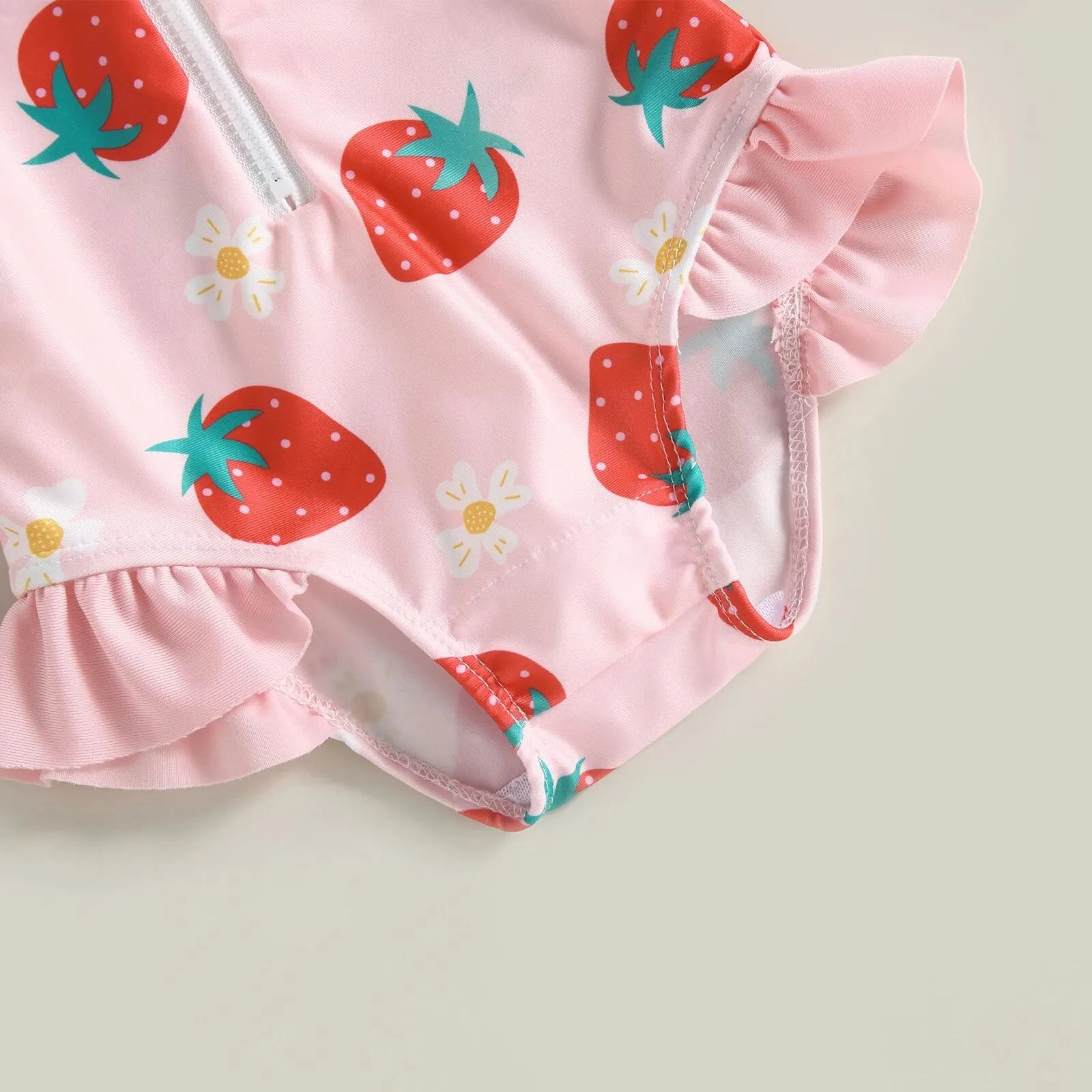 Baby girl one-piece swimsuit with floral flamingo print by Baby Bubble, featuring bright, colorful tropical floral and flamingo design.