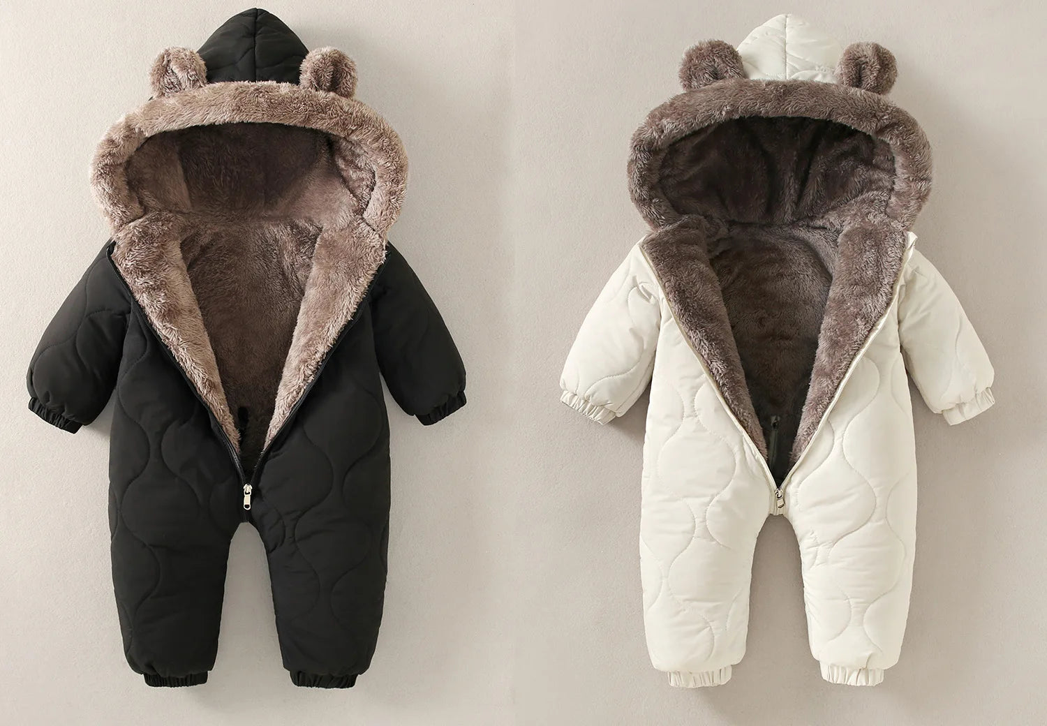 Baby Bubble winter jumpsuit with warm fur lining and cute cartoon print, perfect for keeping babies cozy in cold weather.