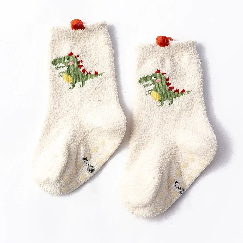 Baby Bubble baby dinosaur socks in soft, warm fabric with colorful dinosaur patterns for infants.