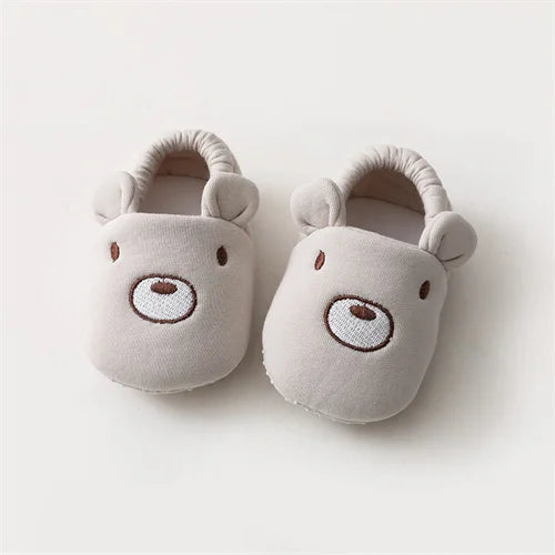 Baby Bubble first walker crib shoes with soft anti-slip soles, designed for infants learning to walk, in a cute sneaker style.