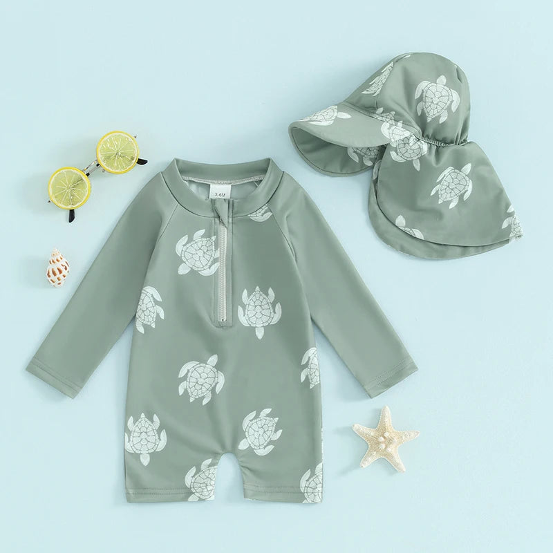 Baby boys rash guard set with turtle and dinosaur print from Baby Bubble, featuring short sleeves and vibrant aquatic design.