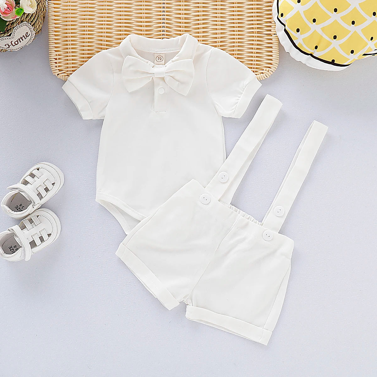 Baby Bubble newborn boy gentleman bowtie romper in a summer set, featuring a cute bowtie and romper for ages 0-24 months.