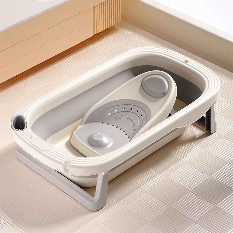 Foldable Baby Bath Tub with temperature sensor from Baby Bubble, showing the tub folded and the temperature indicator in use.