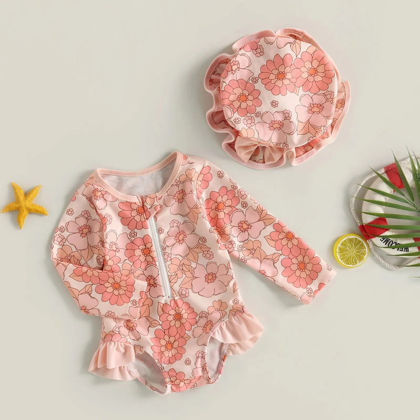 Baby girl one-piece swimsuit by Baby Bubble featuring a floral flamingo print, with colorful tropical design and adjustable straps.