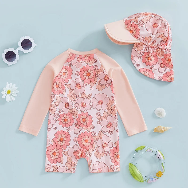 Baby Girl rash guard set by Baby Bubble featuring a floral and flamingo print, with matching swimwear top and bottoms.
