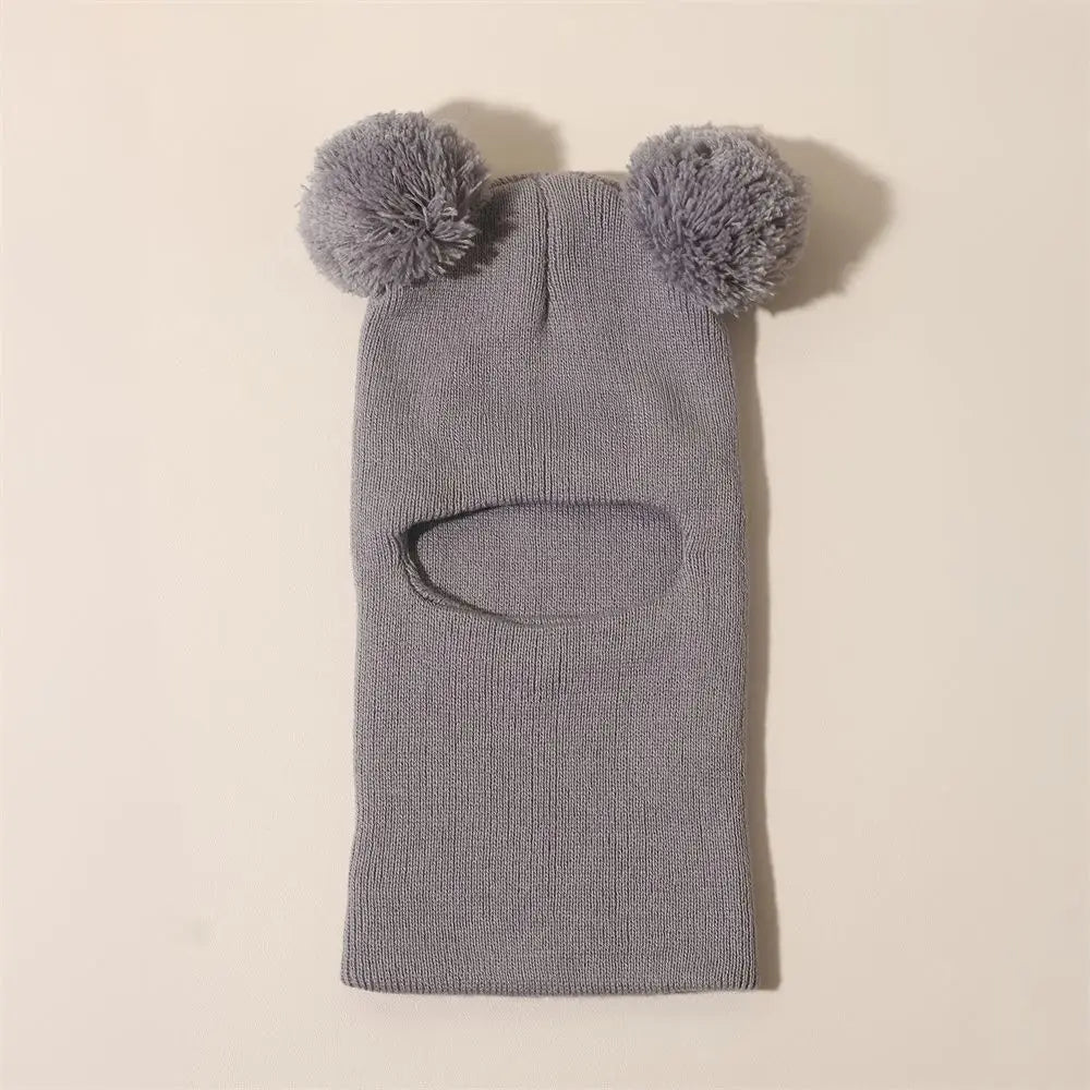 Baby Bubble winter children's hooded knitted cap, cozy and warm children's hat with a soft knit texture and snug fit.