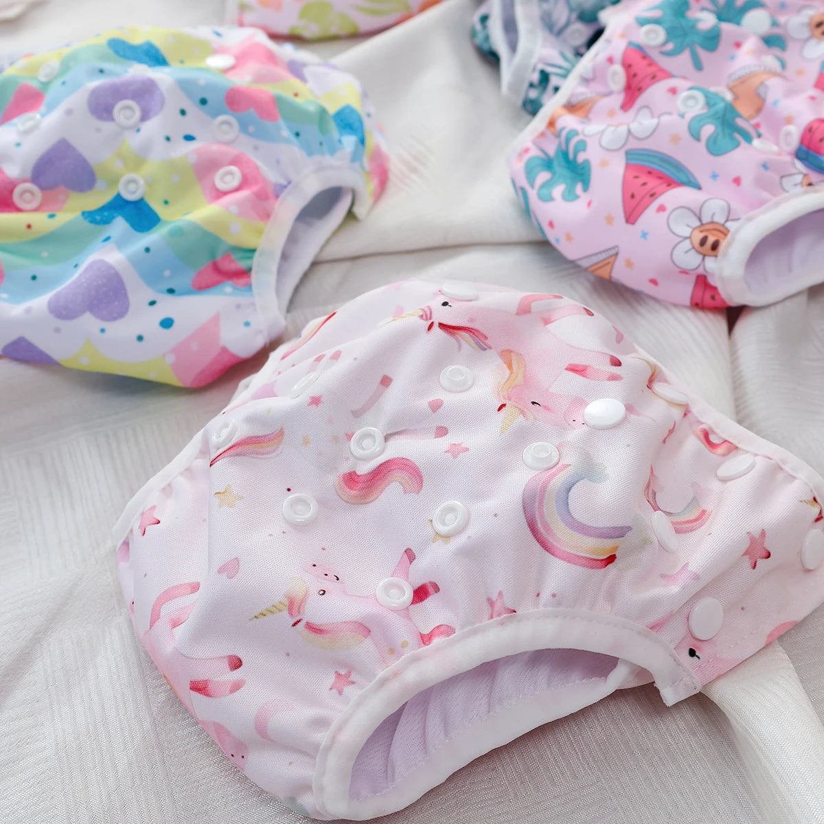 Baby Bubble washable baby swim diapers with adjustable fit, shown in soft waterproof fabric for comfortable swimming.