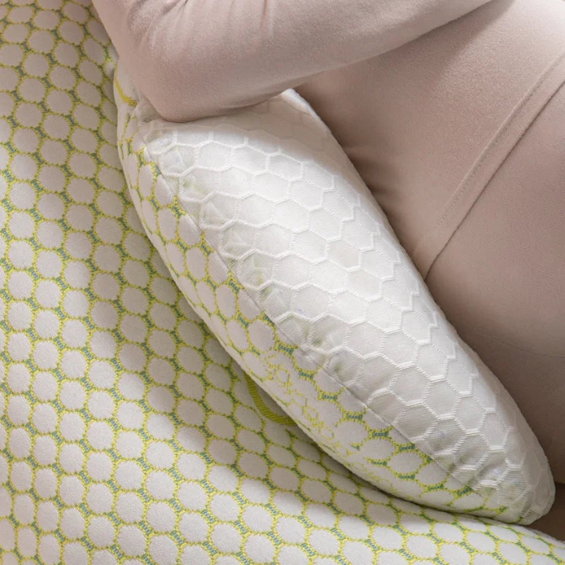 U-shaped pregnancy pillow by Baby Bubble providing full body sleep support, shown in a cozy, cushioned setup for pregnant comfort.