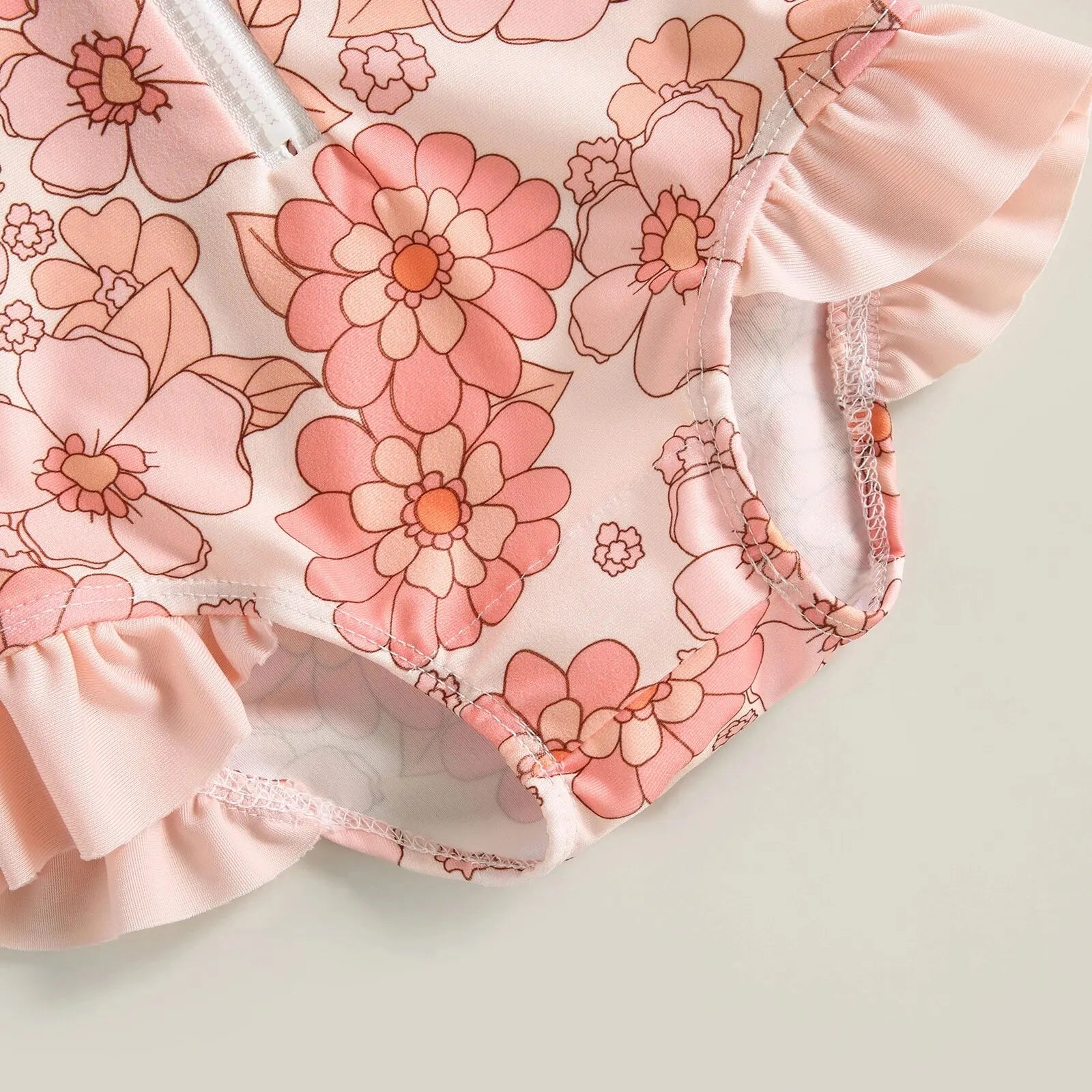 Baby Girl one-piece swimsuit with floral flamingo print by Baby Bubble, featuring bright colors and soft fabric for swimming fun.