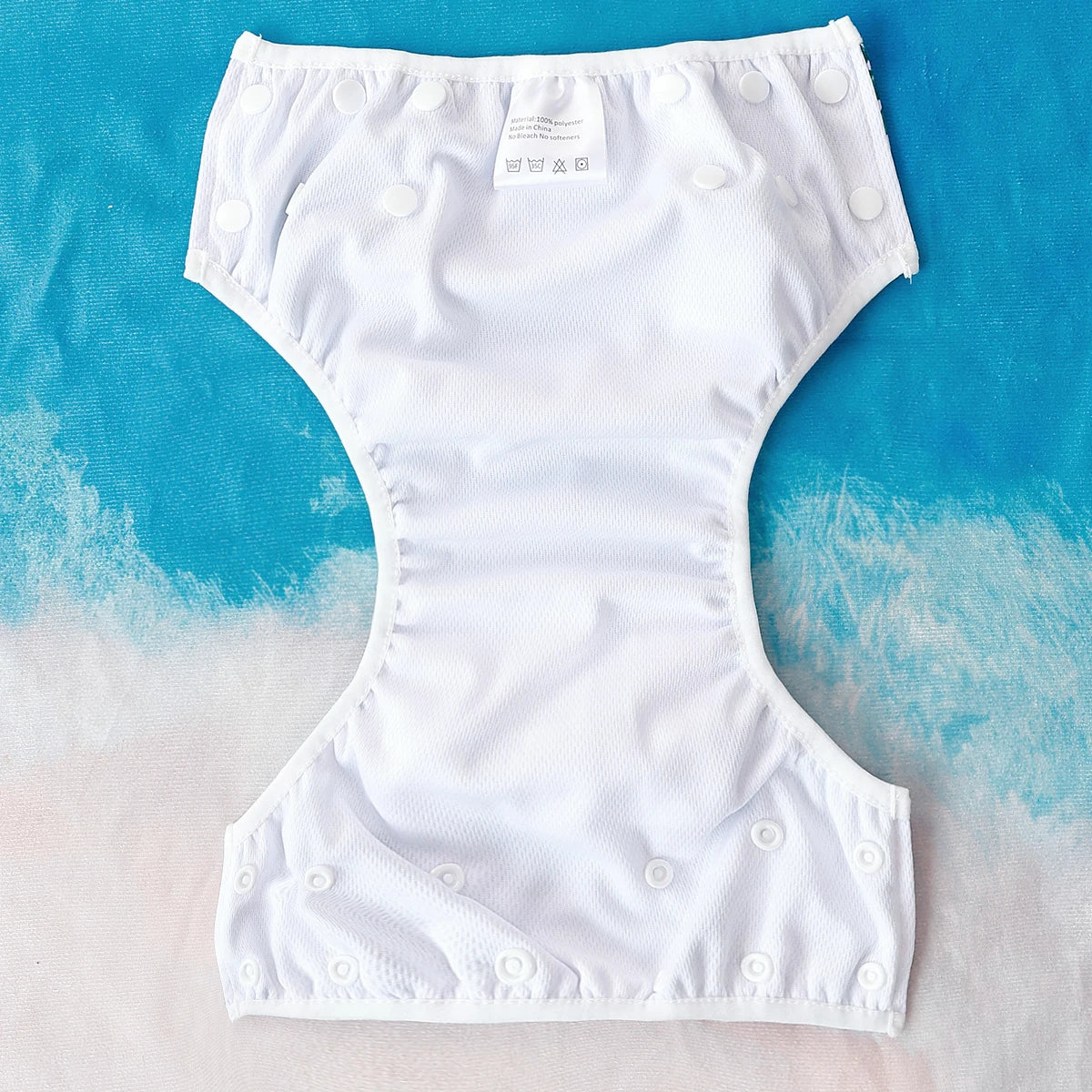 Baby Bubble washable and adjustable baby swim diapers with a snug fit, shown in the image with colorful waterproof material.