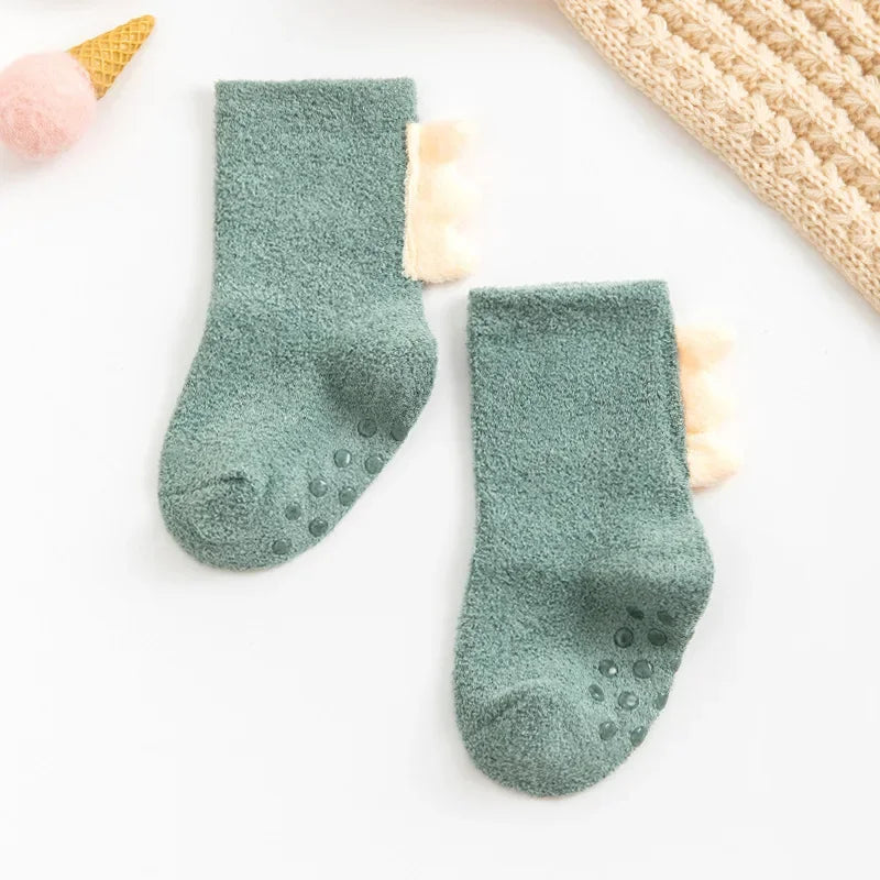 Baby Dinosaur socks by Baby Bubble featuring colorful, soft, and warm baby socks with dinosaur patterns for infants.