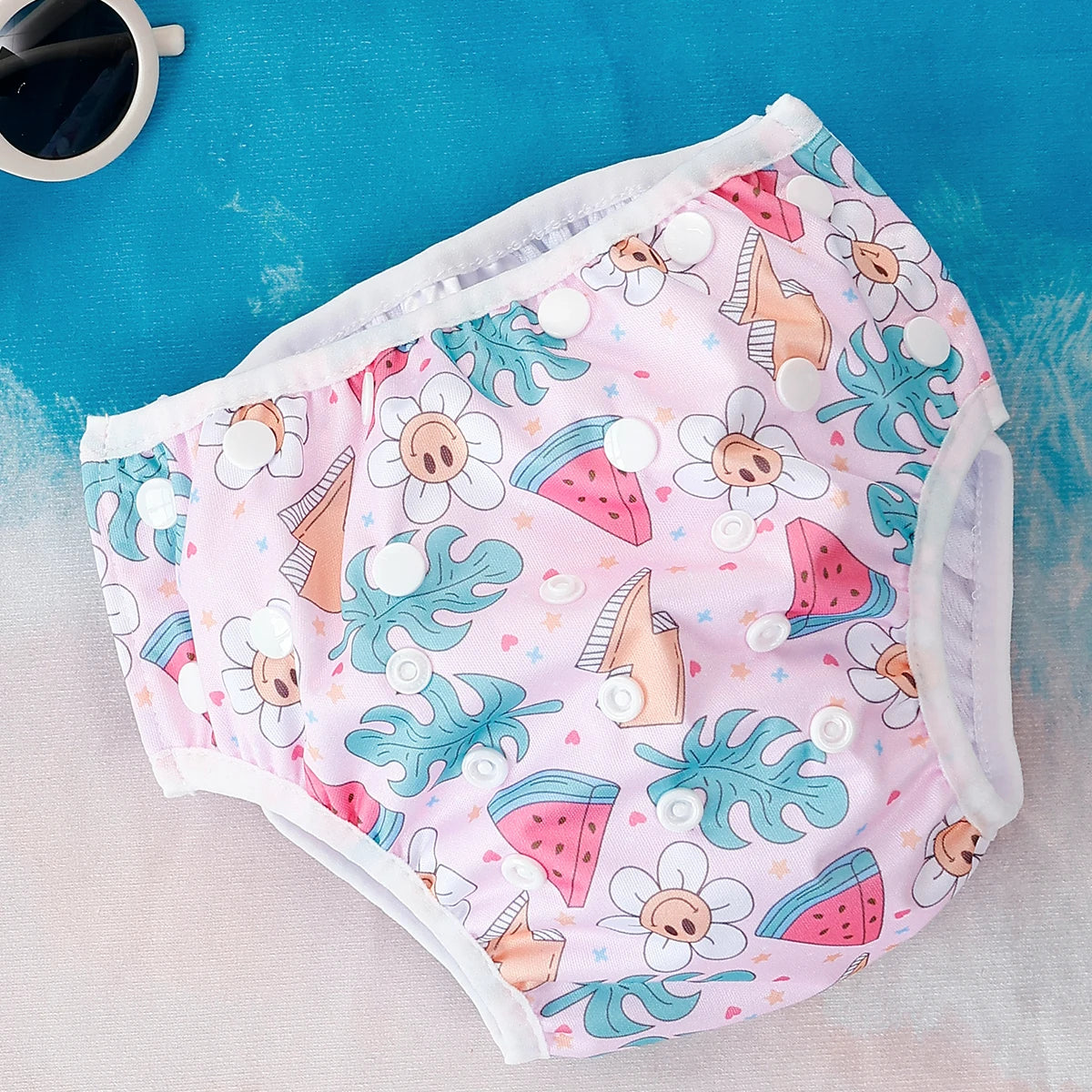 Baby Bubble washable baby swim diapers with adjustable fit, shown in a colorful design suitable for pool or beach use.